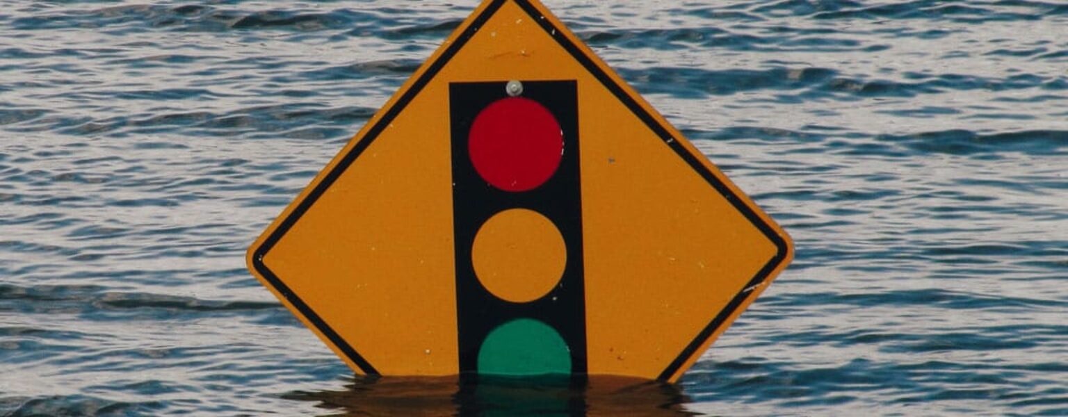 IT Disaster Recovery VS Business Continuity IT Disaster Recovery sign in flooded water