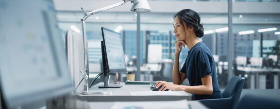 A woman working in an office utilizing cloud continuity features