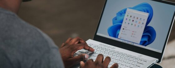 A man using a Windows laptop