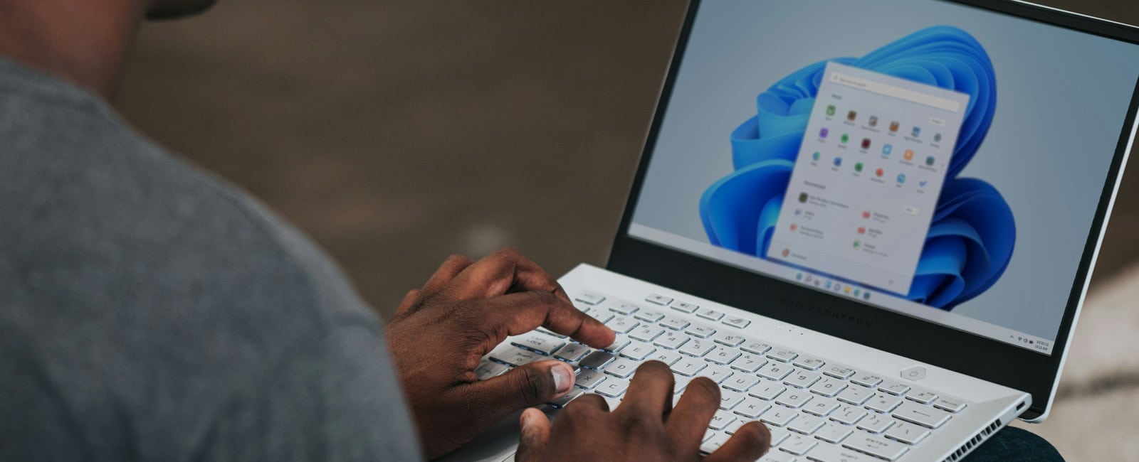 A man using a Windows laptop
